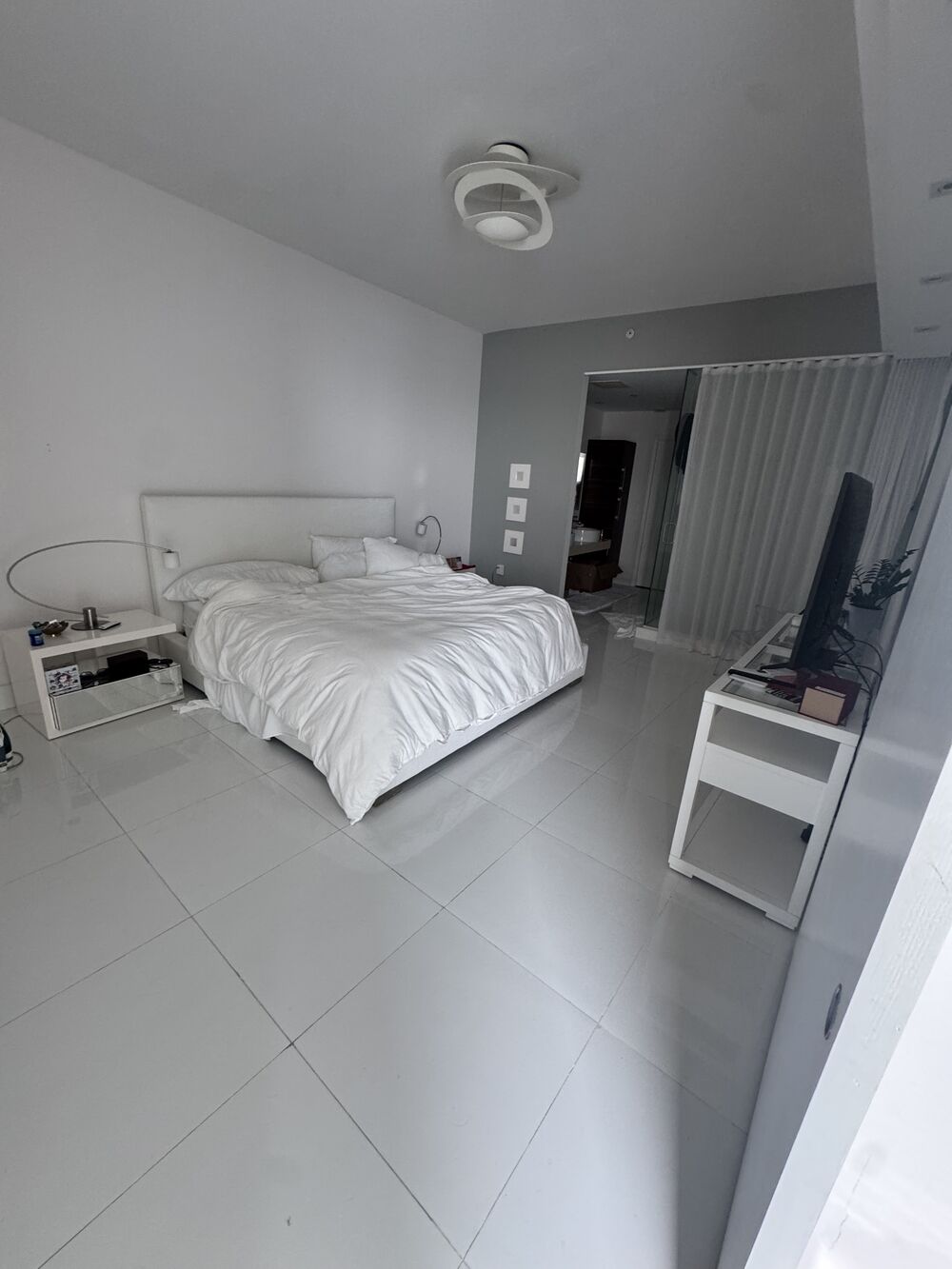 South Miami short-term rental bedroom with the bed made and guest-ready